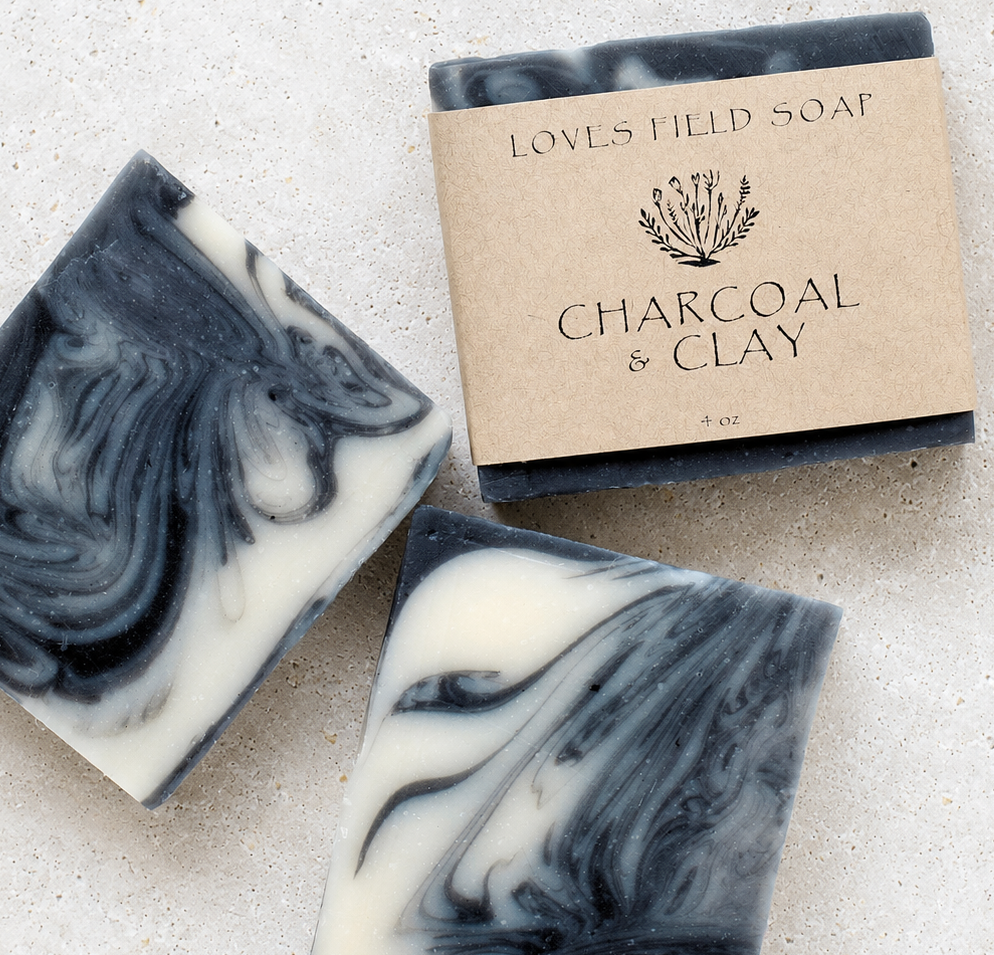 black and white swirled soap bar on white background