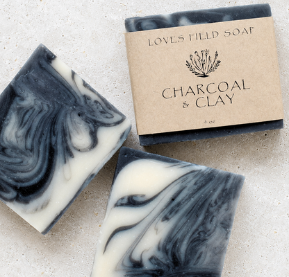 black and white swirled soap bar on white background
