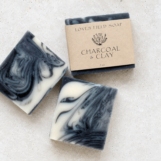 black and white swirled soap bar on white background