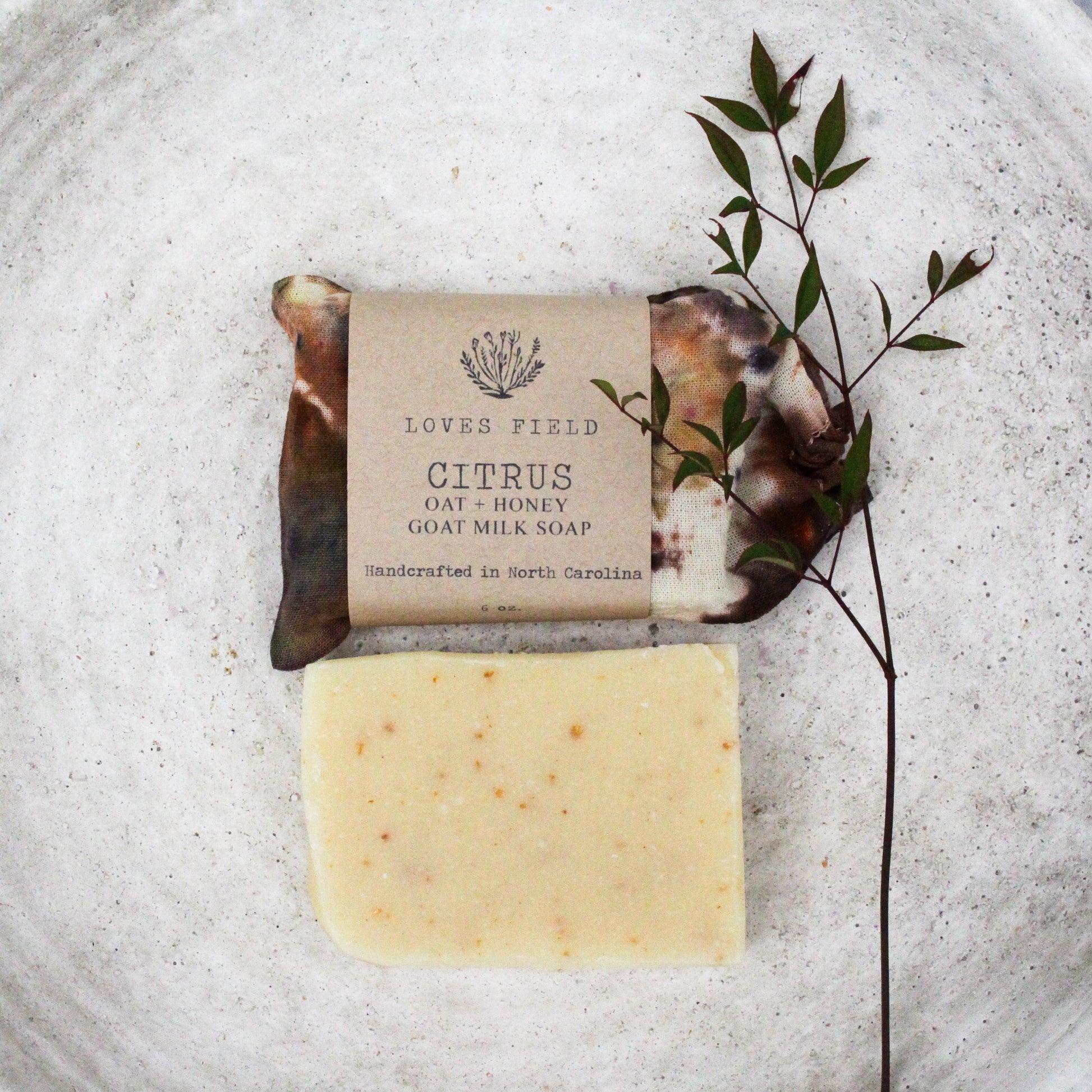 handmade citrus oatmeal goat milk soap bar in hand dyed cotton gift bag, cold process palm oil free