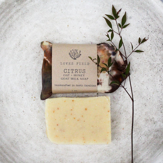 handmade citrus oatmeal goat milk soap bar in hand dyed cotton gift bag, cold process palm oil free