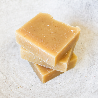 3 stacked bars of orange spice oatmeal soap