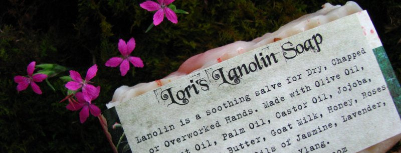 Bar of soap with a label on a dark background with pink flowers