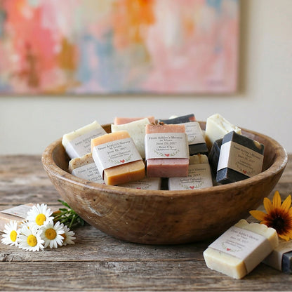 Wooden bowl filled with 50 soap favors displayed at a bridal shower table