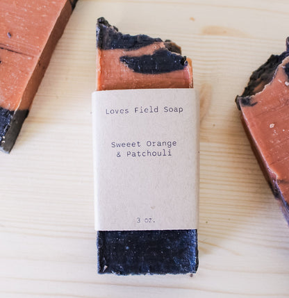 handmade orange patchouli soap bar, cold process palm oil free with activated charcoal and red clay